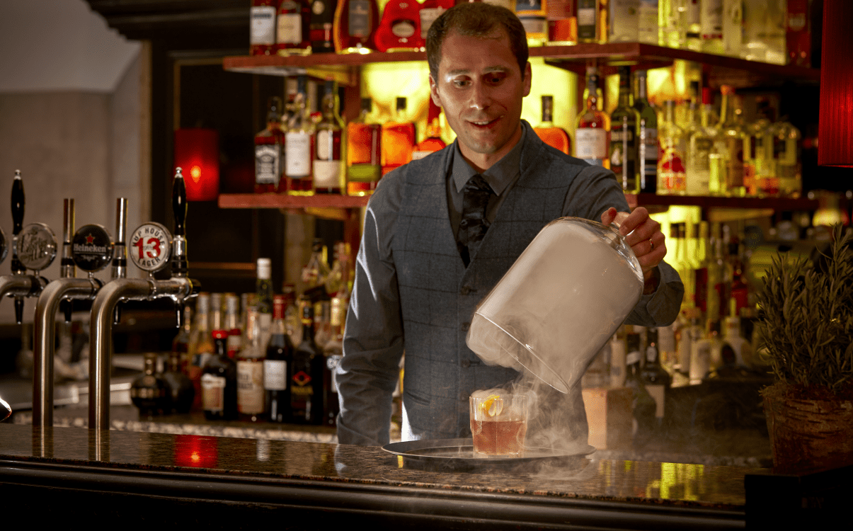 Bartender revealing smoking cocktail in The College Green Hotel Dublin
