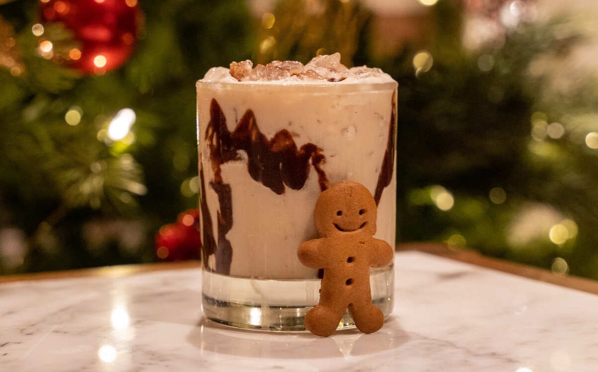 Chocolate cocktail with gingerbread man and Christmas decorations
