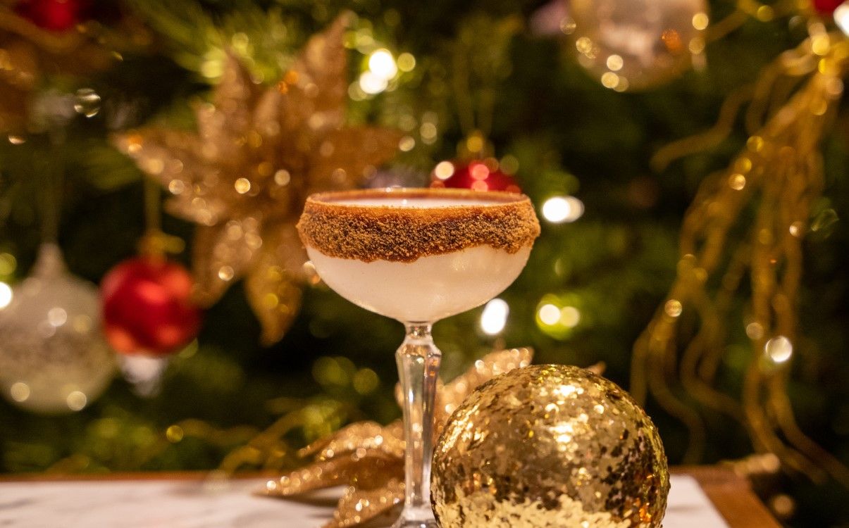 Festive cocktail with Christmas decorations and chocolate topping